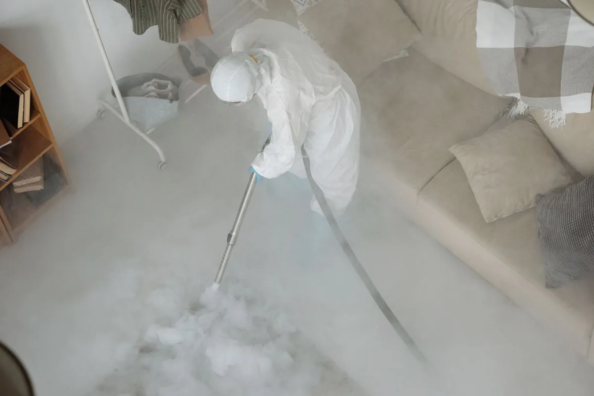 Biohazard cleanup technician in protective equipment, Mendota Heights, MN